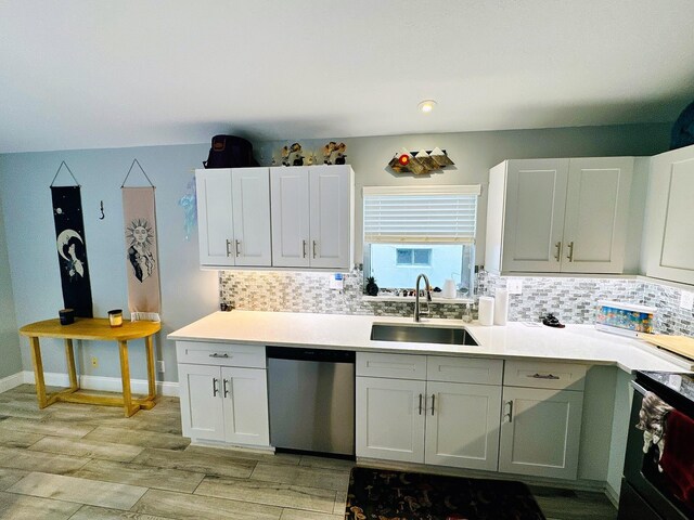 kitchen with sink, stainless steel dishwasher, and white cabinetry