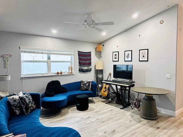 living room featuring light wood-type flooring and ceiling fan