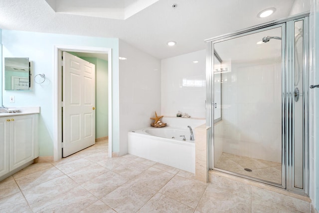 bathroom with vanity, tile patterned flooring, and separate shower and tub