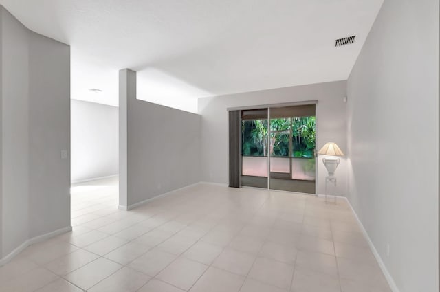 empty room featuring light tile patterned floors