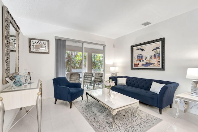 living room with light tile patterned floors