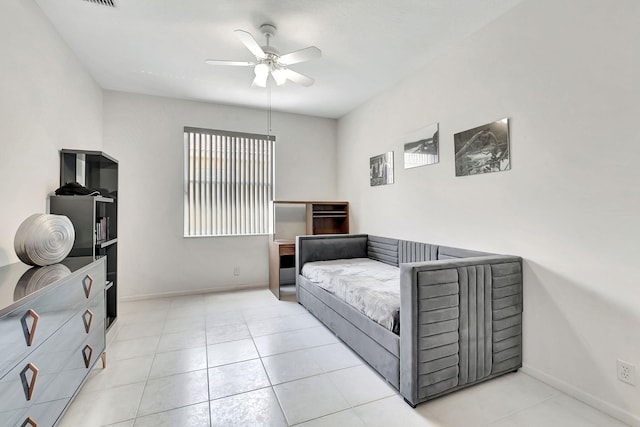 tiled bedroom with ceiling fan