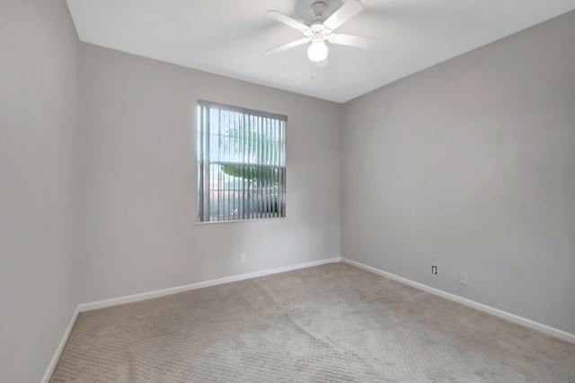 unfurnished room featuring light carpet and ceiling fan