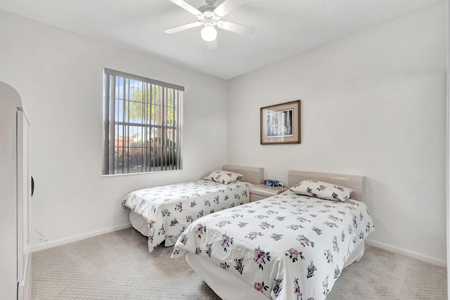 bedroom with ceiling fan and light colored carpet