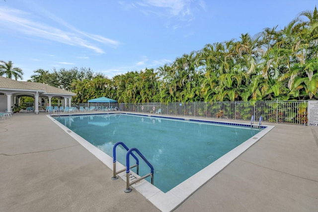 view of swimming pool featuring a patio area