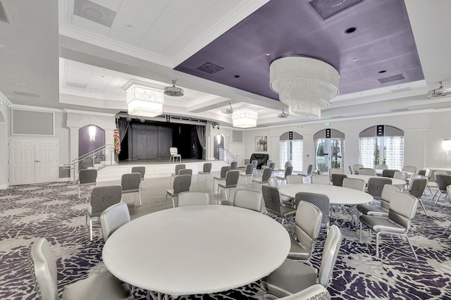 dining room featuring ceiling fan, a raised ceiling, and ornamental molding