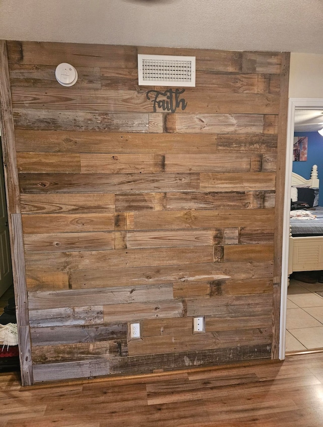 details featuring a textured ceiling and hardwood / wood-style flooring