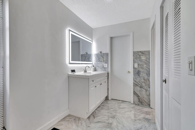 corridor featuring light tile patterned floors and a textured ceiling