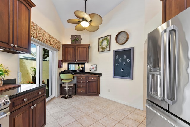 kitchen featuring appliances with stainless steel finishes, high vaulted ceiling, light tile patterned floors, and ceiling fan