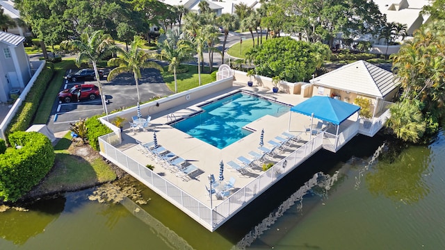 birds eye view of property featuring a water view