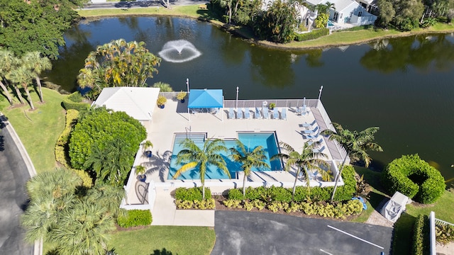 birds eye view of property with a water view