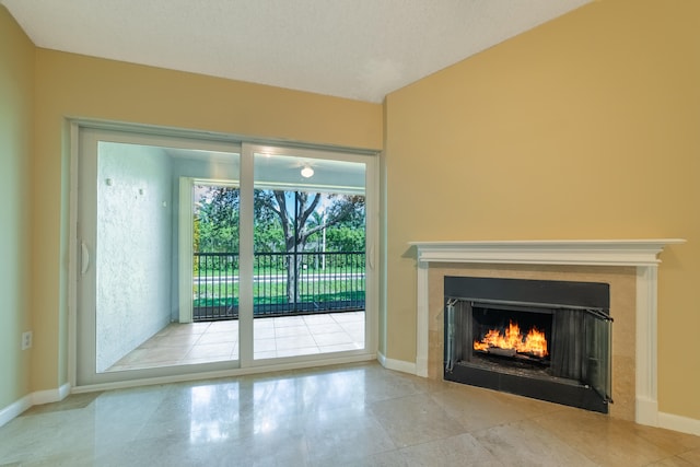 doorway to outside featuring a tile fireplace