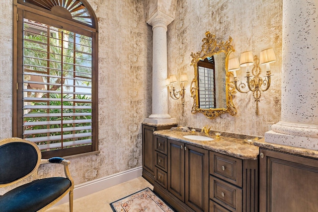 bathroom with vanity and decorative columns