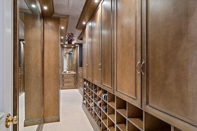 wine cellar with crown molding and wood walls