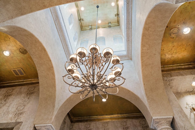 room details with a notable chandelier and crown molding