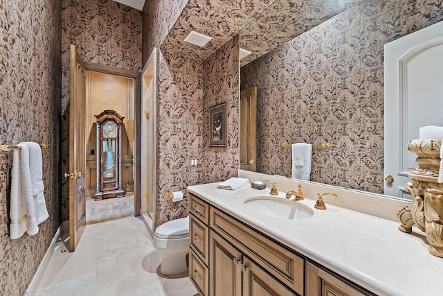 bathroom with vanity and toilet