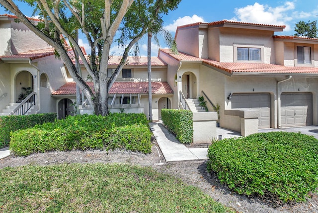 mediterranean / spanish-style house featuring a garage