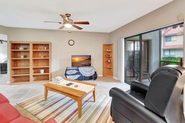 tiled living room featuring ceiling fan