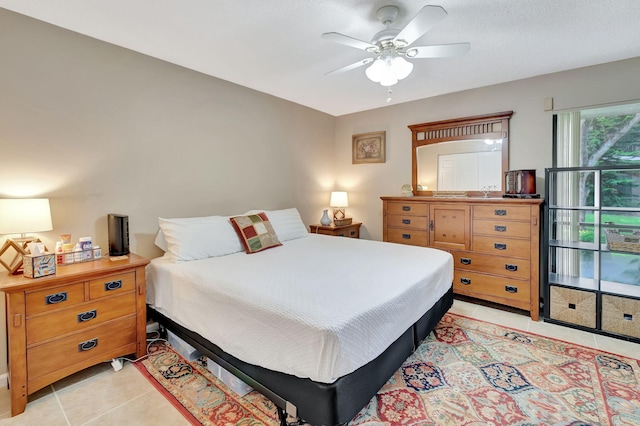 bedroom featuring ceiling fan and light tile patterned floors