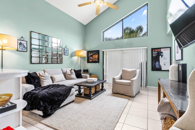 tiled living room with high vaulted ceiling and ceiling fan