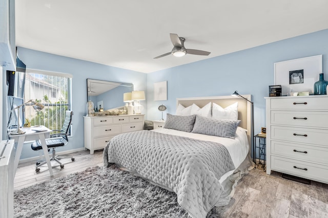 bedroom featuring ceiling fan and light hardwood / wood-style floors