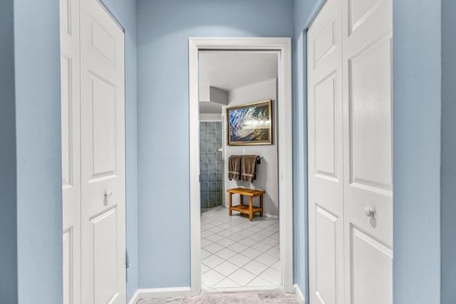 corridor featuring light tile patterned flooring