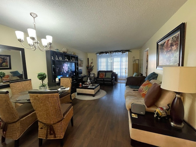 living room with an inviting chandelier, a textured ceiling, and hardwood / wood-style flooring