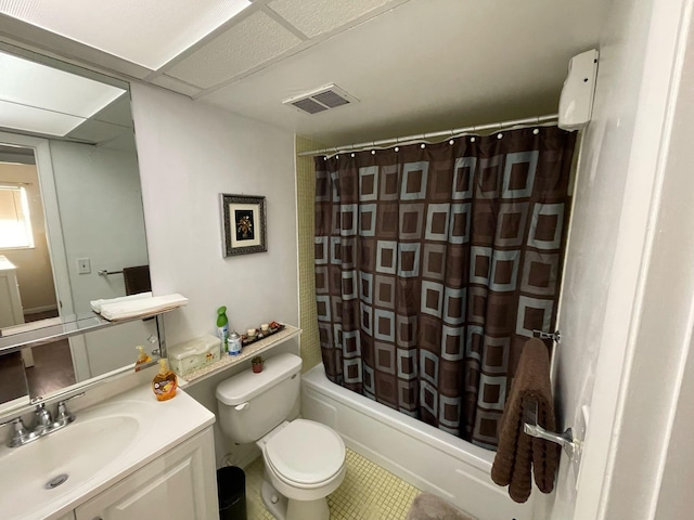 full bathroom with shower / tub combo, tile patterned flooring, vanity, and toilet