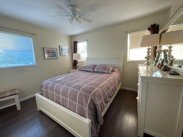 bedroom featuring dark hardwood / wood-style floors and ceiling fan