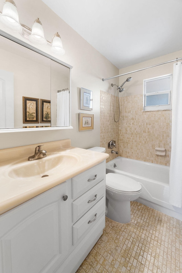 full bathroom with shower / tub combo, vanity, and toilet