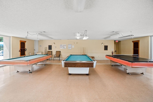 game room featuring a textured ceiling and pool table