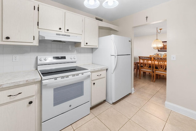 kitchen featuring hanging light fixtures, white cabinetry, backsplash, white appliances, and light tile patterned floors