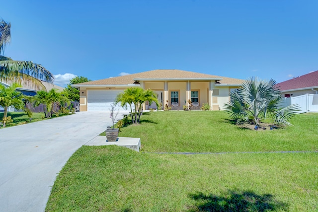 view of front facade with a garage and a front lawn