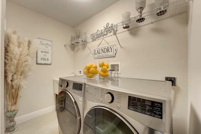 laundry room featuring washing machine and dryer