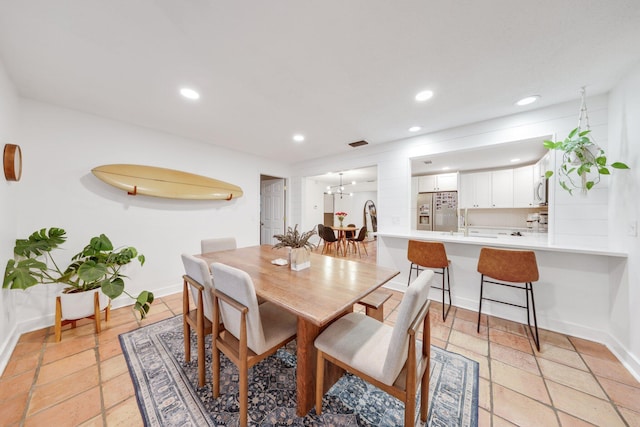 dining area featuring an inviting chandelier