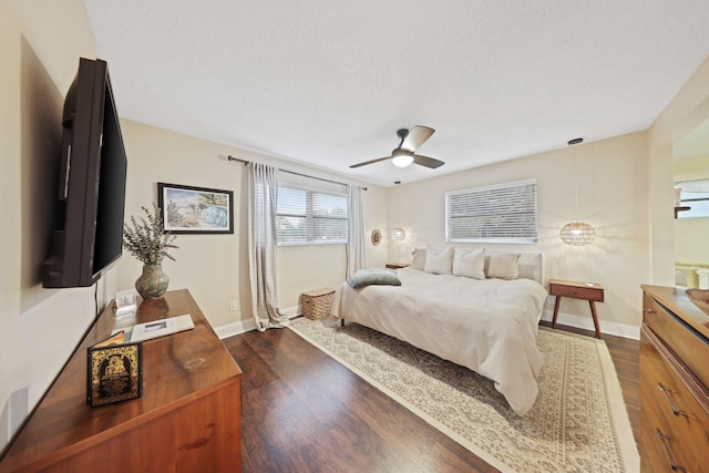 bedroom featuring a textured ceiling, dark hardwood / wood-style flooring, and ceiling fan