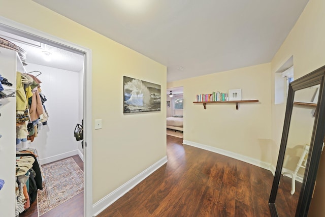 hall with dark wood-type flooring