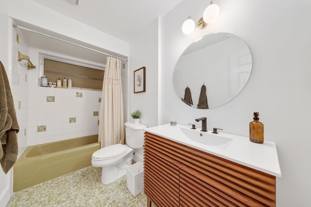 full bathroom featuring tile patterned floors, shower / bath combo with shower curtain, vanity, and toilet