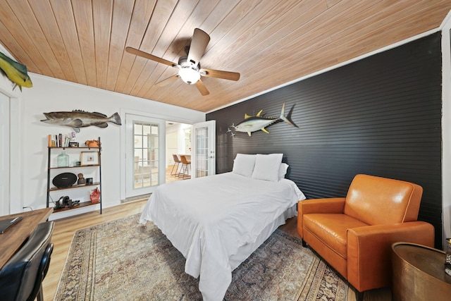 bedroom with hardwood / wood-style flooring, ceiling fan, wood ceiling, and french doors