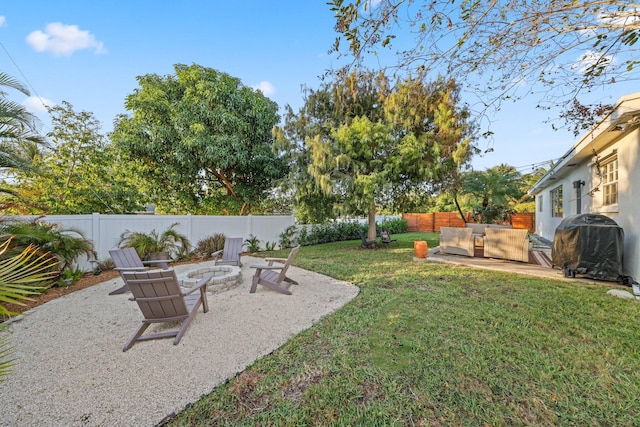 view of yard featuring a patio and a fire pit