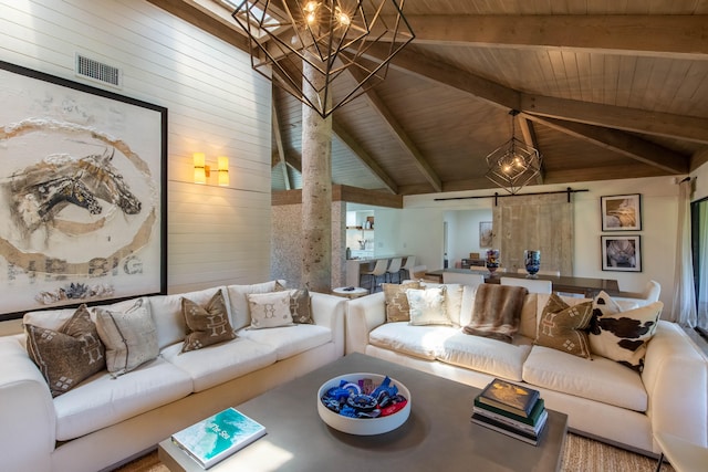 living room featuring a barn door, wooden walls, lofted ceiling with beams, and wooden ceiling