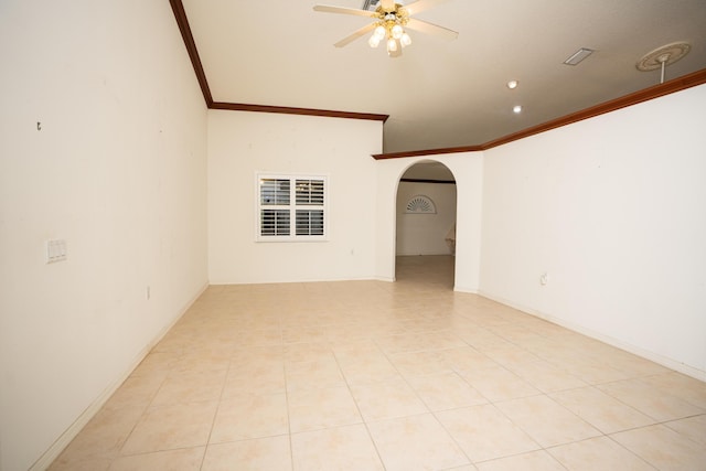 empty room featuring light tile patterned floors, ceiling fan, and crown molding