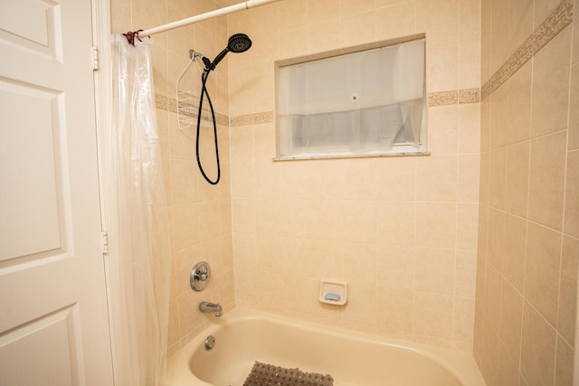 bathroom featuring shower / tub combo with curtain