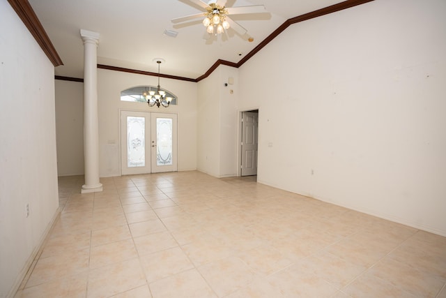 tiled entryway featuring high vaulted ceiling, french doors, ceiling fan with notable chandelier, crown molding, and ornate columns