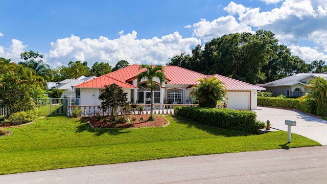 view of front of house with a garage and a front yard