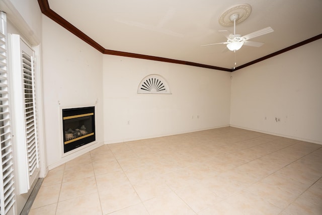 unfurnished living room featuring ceiling fan, crown molding, light tile patterned flooring, and vaulted ceiling