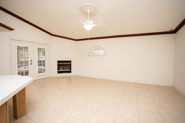 unfurnished living room with ceiling fan, french doors, and lofted ceiling