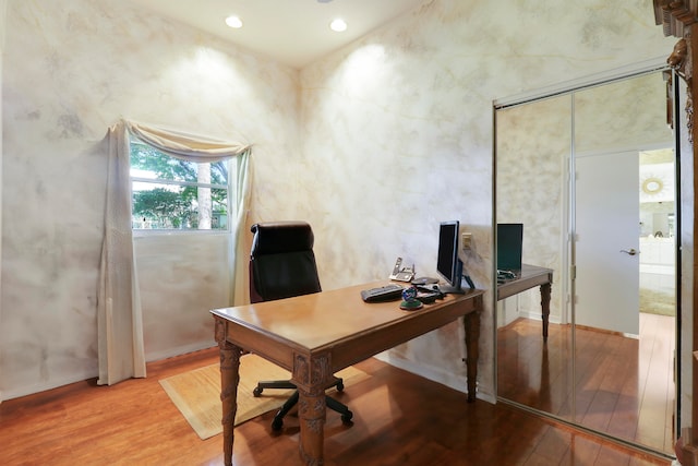 office with light wood-type flooring