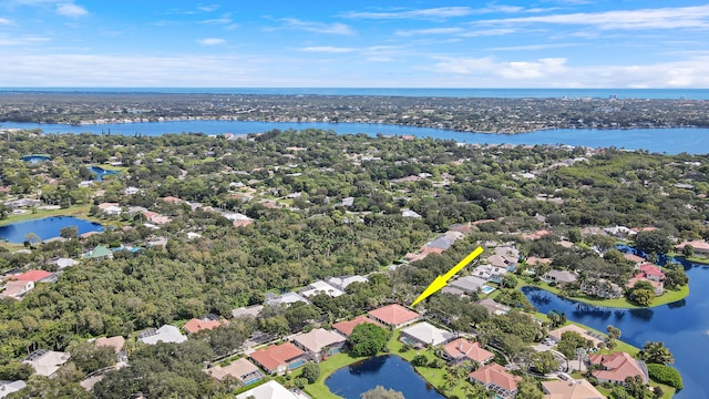 birds eye view of property featuring a water view