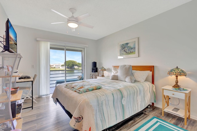 bedroom featuring ceiling fan, hardwood / wood-style floors, and access to outside